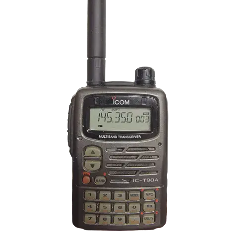 icom ic t90a front view with black antenna attached black textured body single control knob lcd display numeric keypad function keys speaker grille
