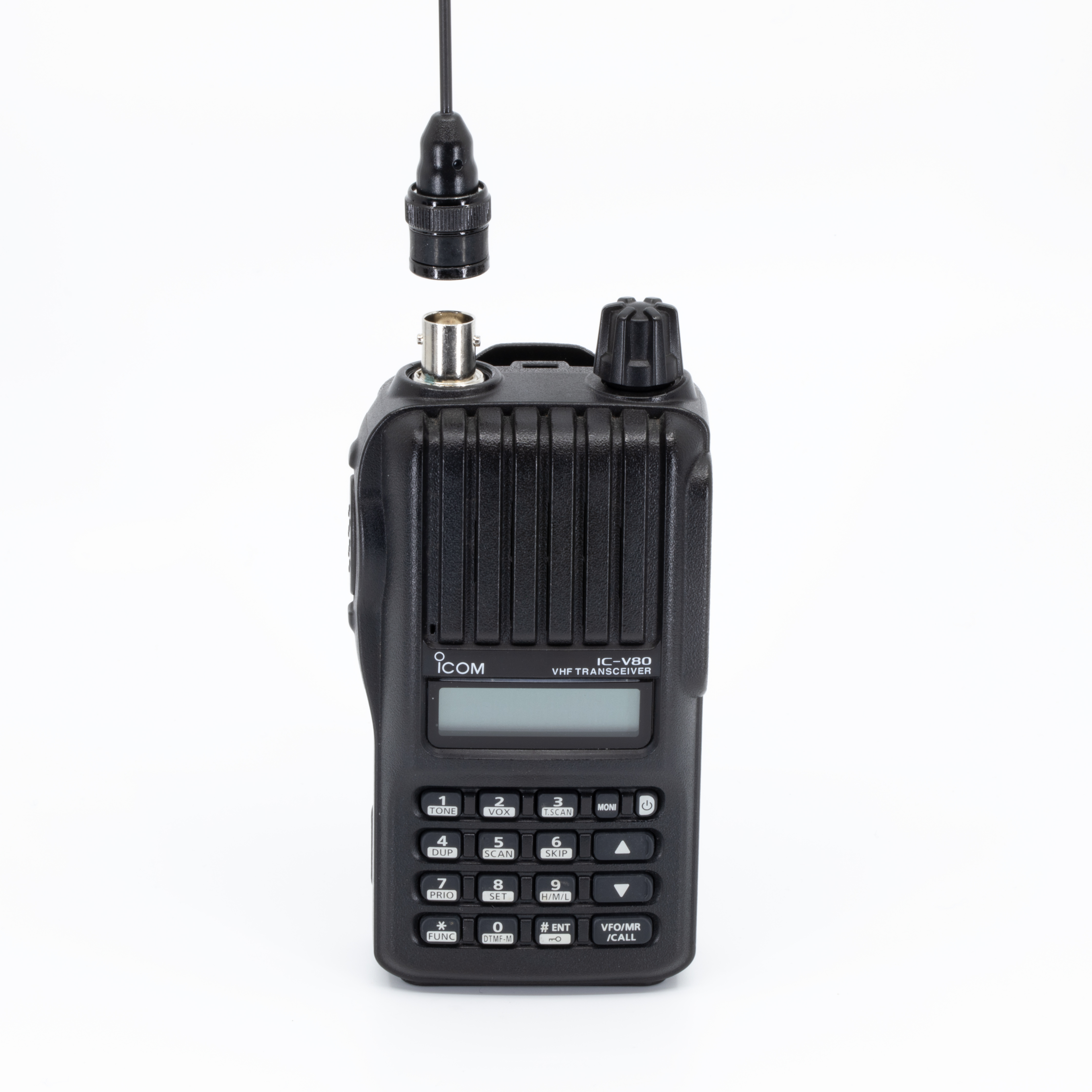 icom ic v80 handheld radio with black ribbed body featuring lcd display numeric keypad with function labels dual control knobs on top and attached black antenna with cable
