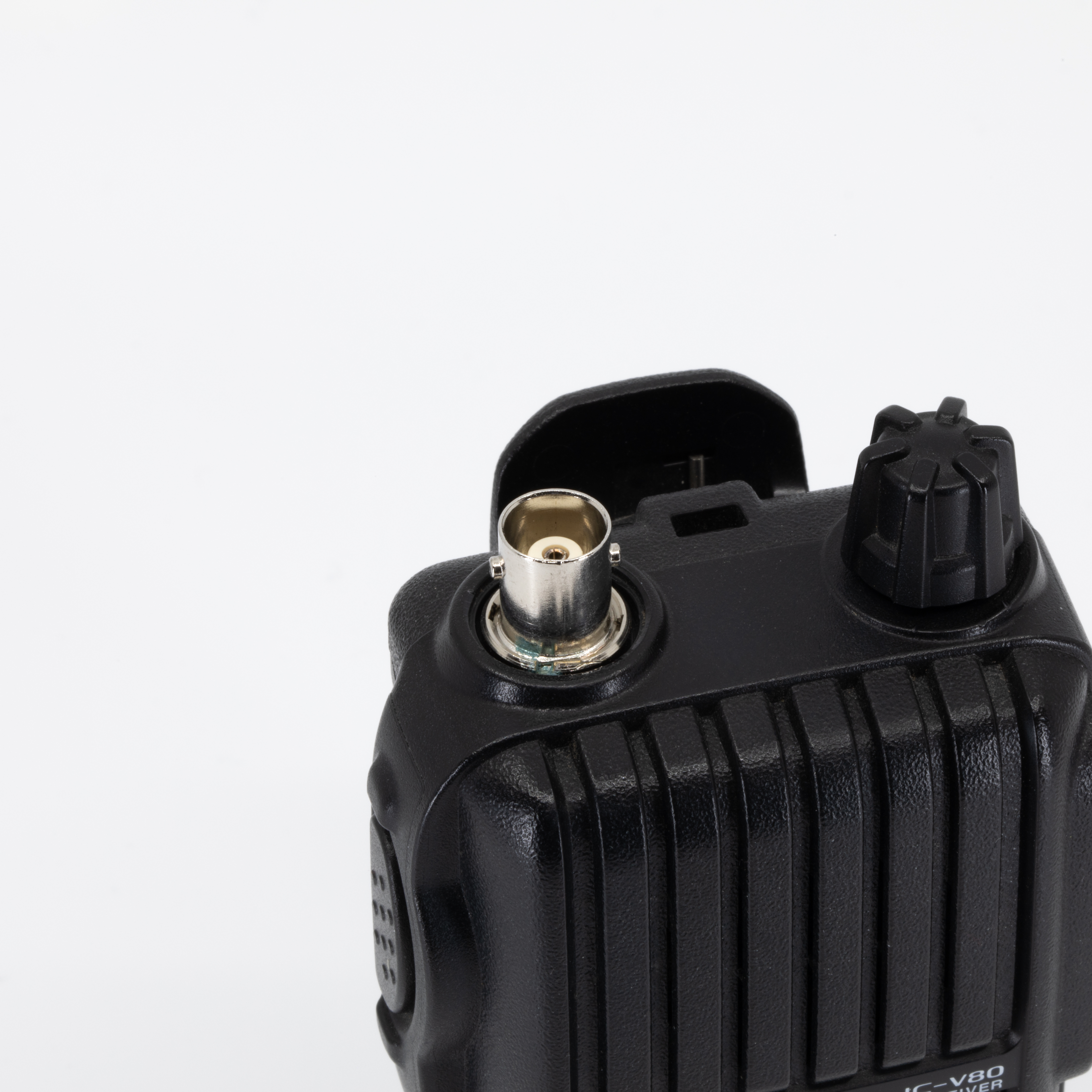 icom ic v80 top view showing bnc connector accepting bnc antenna single control knob and textured black ribbed body