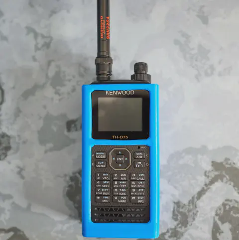 kenwood th d75a front view with black antenna attached black textured body blue 3d printed case single stacked control knob lcd display control buttons numeric keypad speaker grille