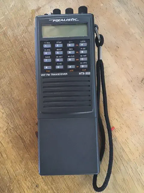 radio shack htx 202 front view without antenna black textured body three control knobs lcd display numeric keypad function keys