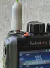 Thumbnail of radioddity gd 88 front top close up view with green sma m signal stick antenna attached showing gap at antenna connector black textured body two control knobs partial lcd display