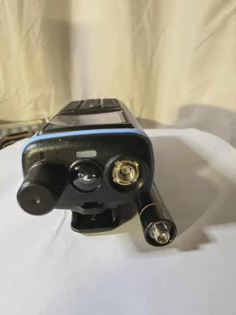 radioddity gm 30 top view showing sma m connector without antenna blue and black textured body single control knob
