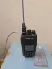 Thumbnail of retevis ailunce rt3s front view with purple signal stick antenna and purple signal strand counterpoise attached black textured body two control knobs speaker grille lcd display numeric keypad