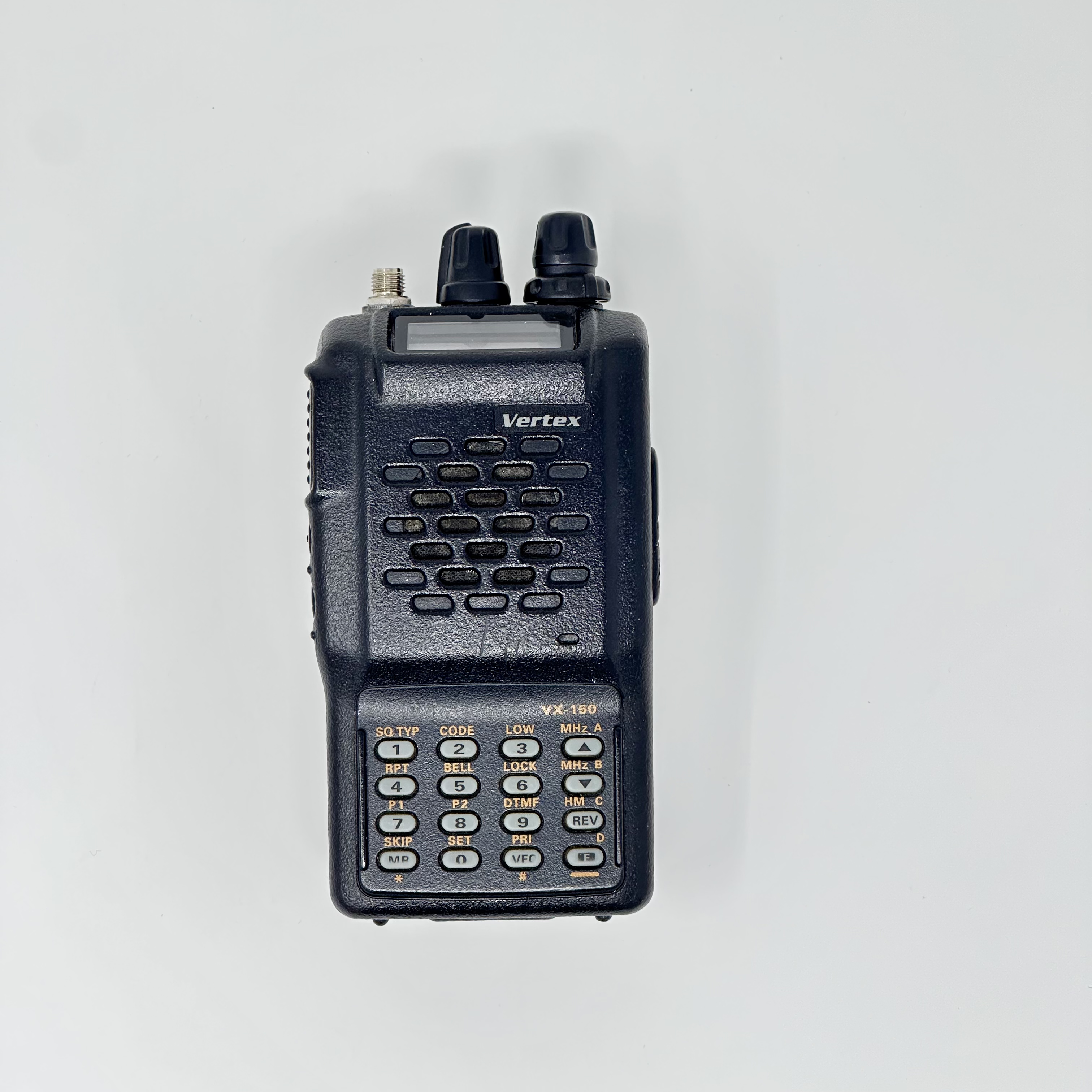 vertex vx150 showing textured black body connector accepting sma f antenna without antenna attached two control knobs on top and labeled numeric keypad with function buttons