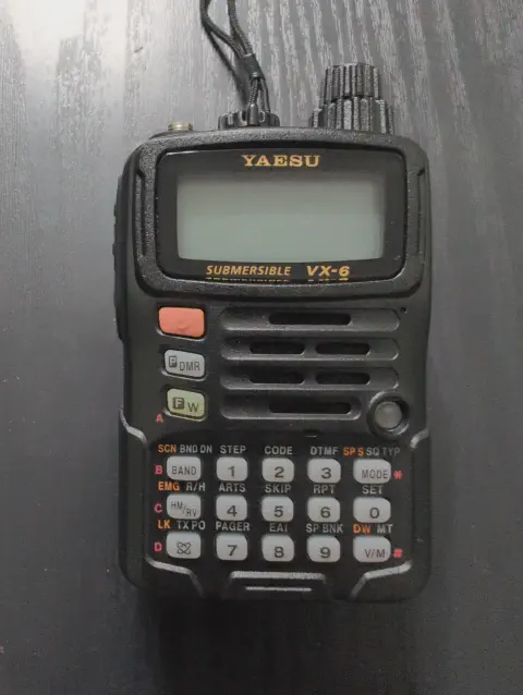 yaesu vertex vx 6r front view without antenna black textured body two control knobs one stacked lcd display control buttons speaker grille numeric keypad