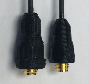 Photograph of the old and new connector caps